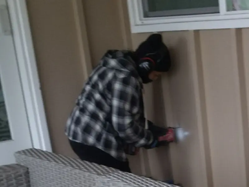 Professional electrician installing an exterior outlet in Hackensack